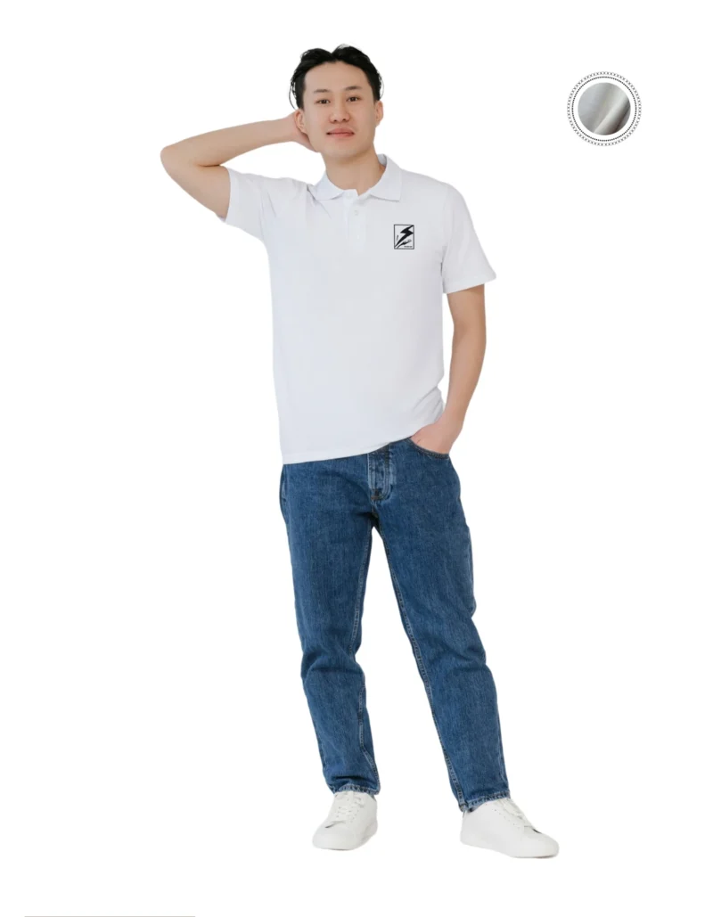 A man wearing a classic white polo shirt and jeans, showcasing a casual yet stylish look.
