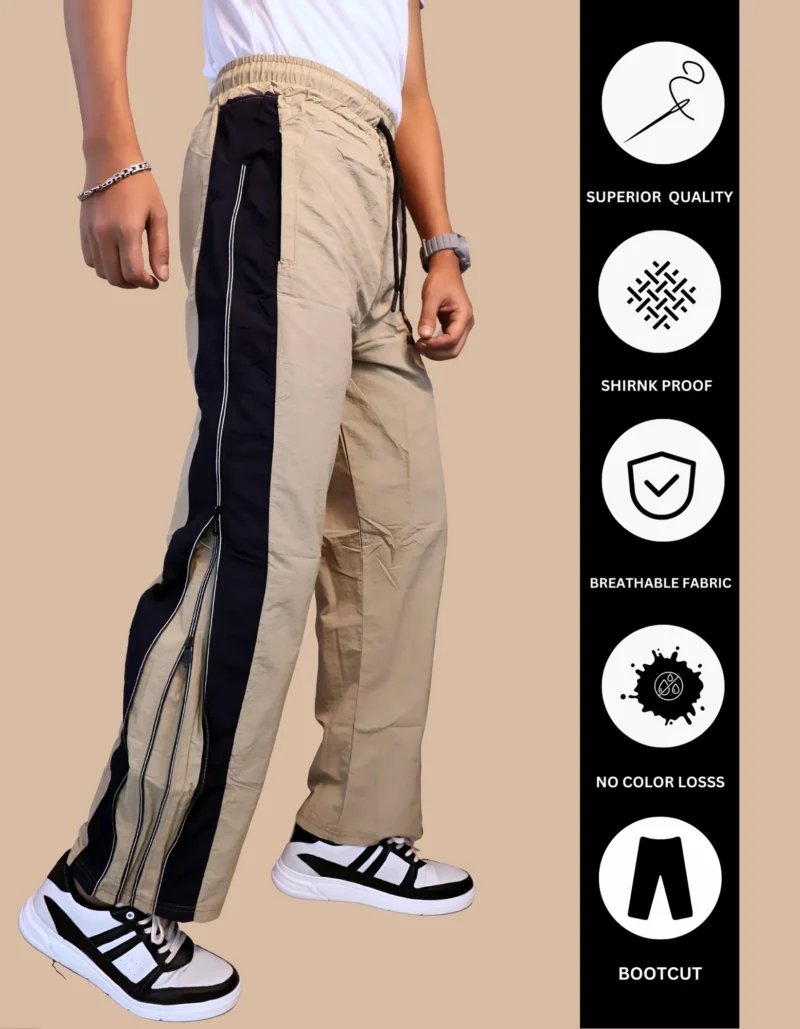 Side view of men's track pants showing convertible zipper opening